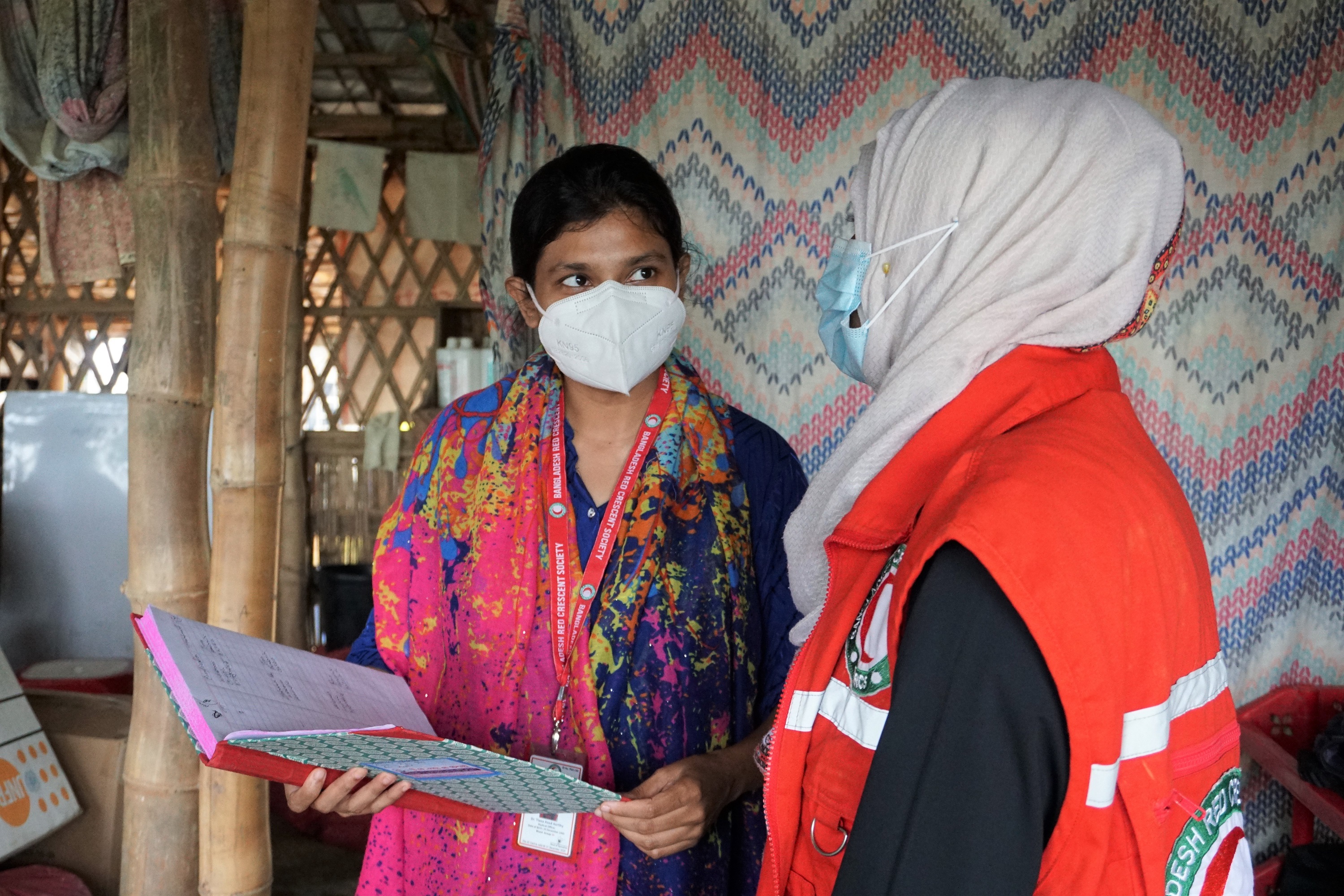 Dr Tiasa and Midwife Afroza educate Rohingya women and girls about early marriage gender based violence and reproductive health in safe space sessions for women.TA