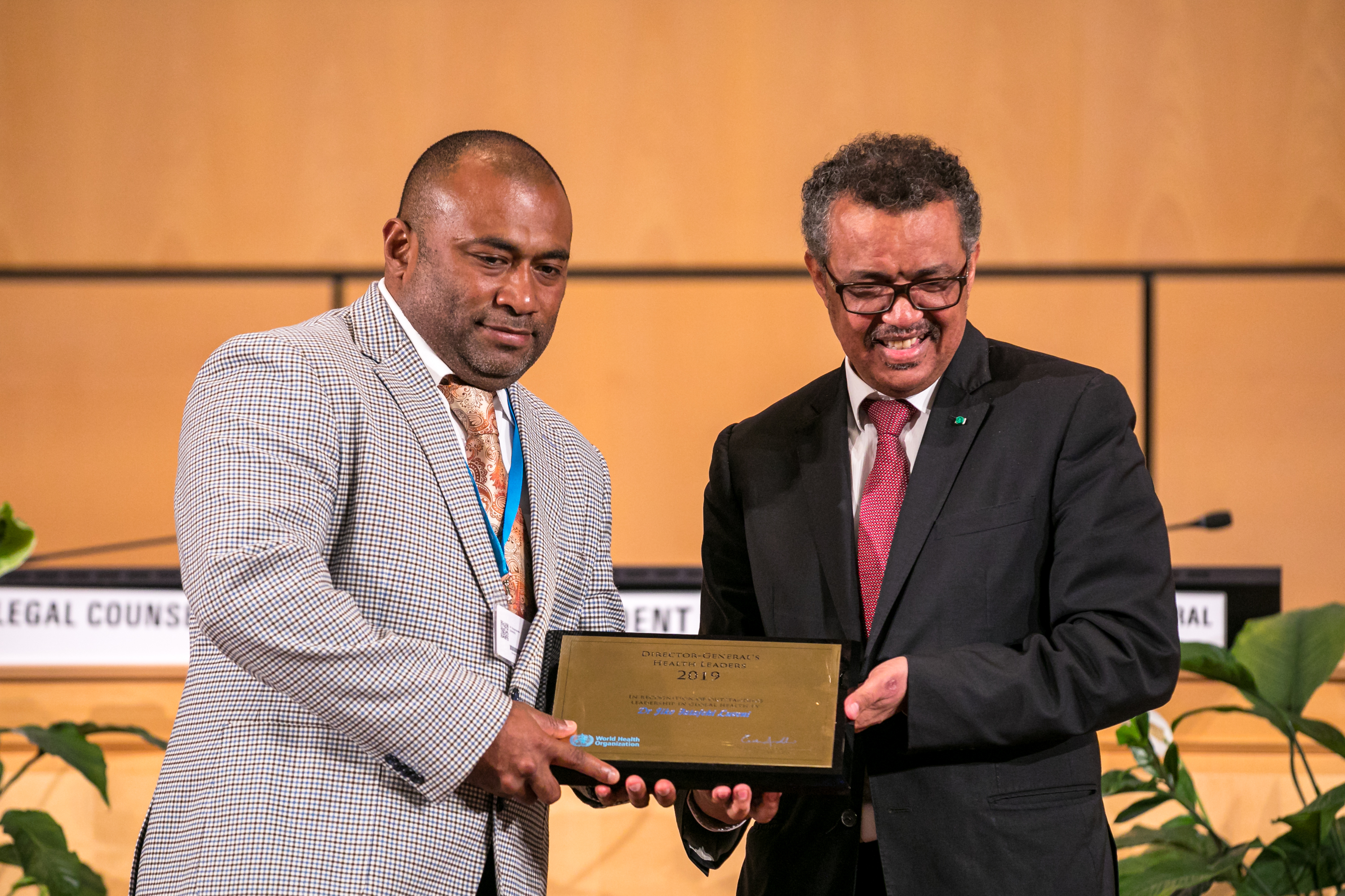 Fiji's Minister of Health & Medical Services receiving the award on Dr Luveni’s behalf from WHO Director General Dr Tedros Ghebreyesus